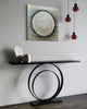 Aura-foyer--mixed-media-wood-art-artist-Cie-Hoover-Modern console table with circular design against a gray wall with abstract art.