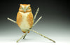 Day-Dreamer-bronze-sculptor-Jeremy-Bradshaw-A bronze owl figurine perched on a cross-shaped branch structure.