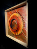 Iridescence-mixed-media-wood-art-artist-Cie-Hoover-Framed abstract artwork with a swirling design in warm colors on a dark background