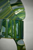 Lighthouse-glass-artist-Evan-Seeling-A sculptural glass vase made of stacked, wavy translucent green glass sections with a central cutout.