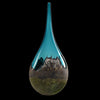 Mountain-Vista-Spire-Front-jared-and-nicole-davis-blown-glass-Teal glass vase with a reflective surface