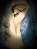 Mountains-of-the-Mind-Cold-Composure-closeup-mixed-media-wood-art-artist-Cie-Hoover-Artistic depiction of a face with gold and blue tones on a textured background