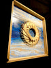 Sea-Breeze-mixed-media-wood-art-artist-Cie-Hoover-Framed artwork with a gold circular design on a blue and white abstract background