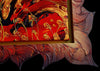 WILD-HEART-OF-THE-MOUNTAINS_-Artist-Pamela-Sukhum-Abstract artwork with swirling patterns in red, gold, and black on a dark background.
