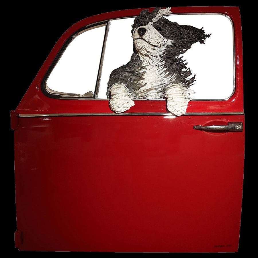 Sheepdog in a Red Volkswagen door original created by Colorado artist DD Larue