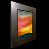 metal framed watercolor painting by artist Kay Stratman of a very colorful sunset sunrise sky - left