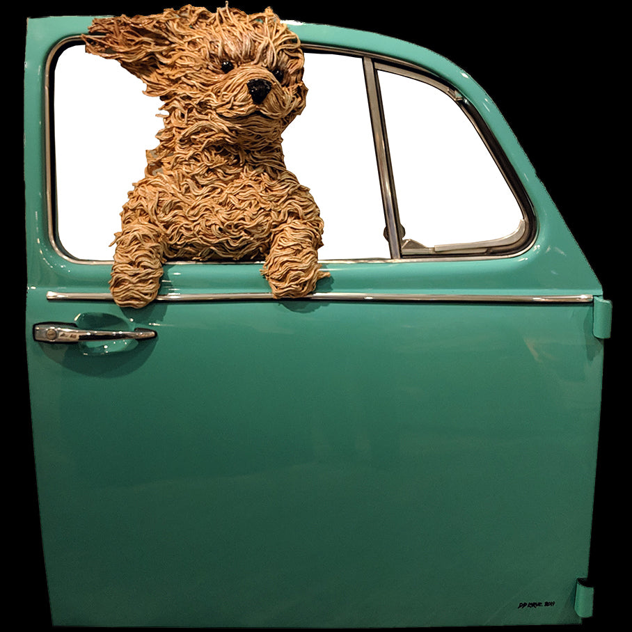 Golden doodle in teal volkswagen door original sculpture by colorado artist DD Larue