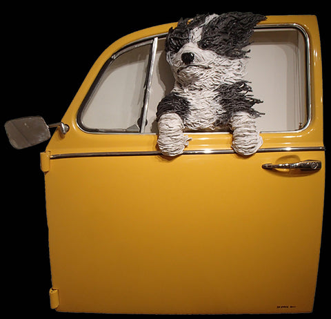 Sheepdog in a Yellow VW Door