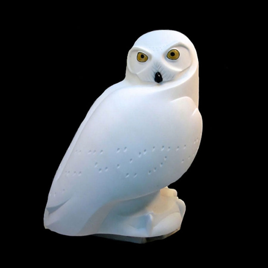 Stone snowy owl sculpture by Ellen Woodbury
